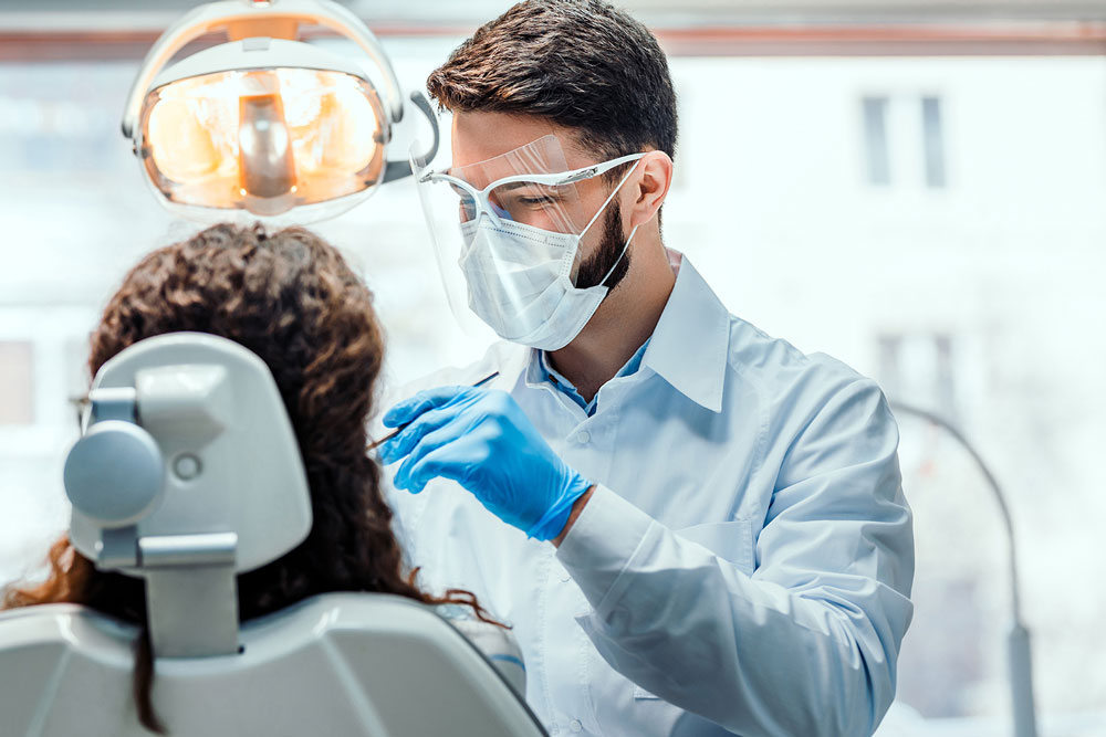 dentist wears face shield