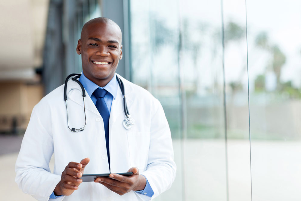 Man in white coat with stethoscope around his neck