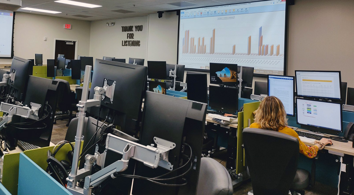 Banks of computers sit in the newly opened 988 call center.