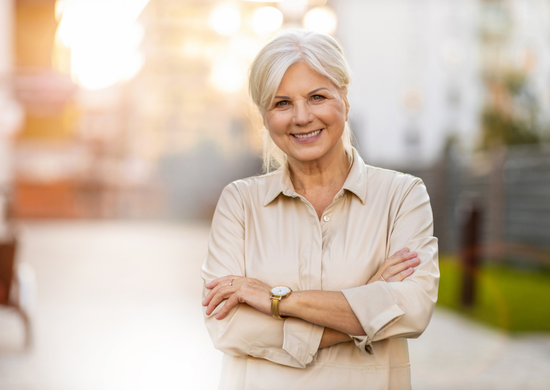 woman crossing her arms smiling at the camera